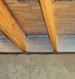 SilverGlo insulation installed in a floor joist