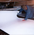 West Bend insulation being installed in a crawl space.