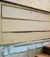 an old-fashioned crawl space door in Elm Grove about to be replaced
