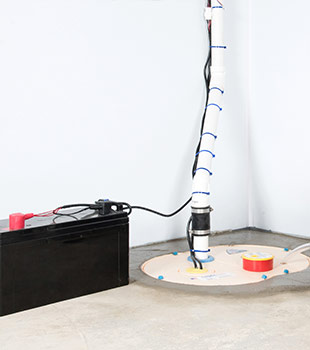 A sump pump installed in Menasha by Sure-Dry Basement Systems