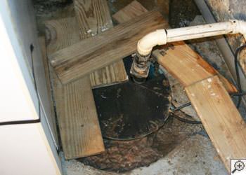 An ugly, clogged sump pump system in Manitowoc, Wisconsin