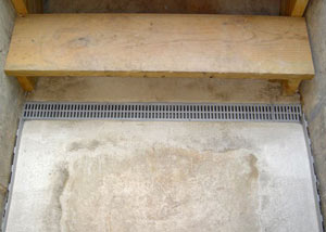 Our grated drain system installed on a leaking basement staircase in Antigo.