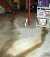 Flooding entering a basement through a floor crack in Shawano