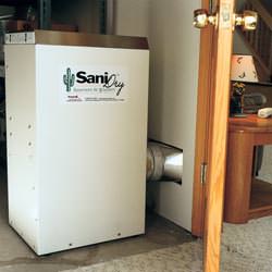 A basement dehumidifier with an Energy Star rating ducting dry air into a finished area of the basement  in New London
