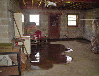 a flooded basement floor in a New London home
