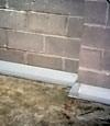 Our baseboard drain system installed on a corner in a Stevens Point basement.
