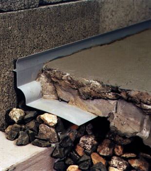 a custom designed basement drain system for thin basement floors in Waupaca.