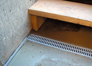 a hatchway entrance in Shawano that has been protected from flooding by our TrenchDrain basement drainage system.