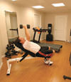 a basement gym and workout room with a wood laminate flooring, installed in Fond Du Lac, WI