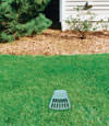 A buried gutter drain downspout extension installed in a New London home