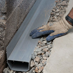 installing a drain tile system in a Two Rivers home