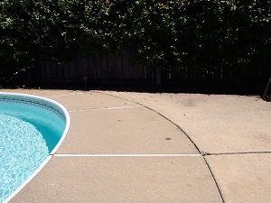 Pool deck raising and leveling Sinking pool deck repaired with PolyLevel® concrete lifting