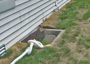 old concrete window well of a Oshkosh crawl space