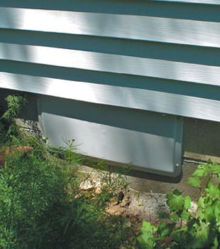 A gray crawl space vent cover in West Bend
