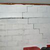 A buckling foundation wall in a Two Rivers home.