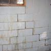 A cracked foundation wall near a window in a Waupaca home