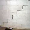 A diagonal stair step crack along the foundation wall of a Merrill home