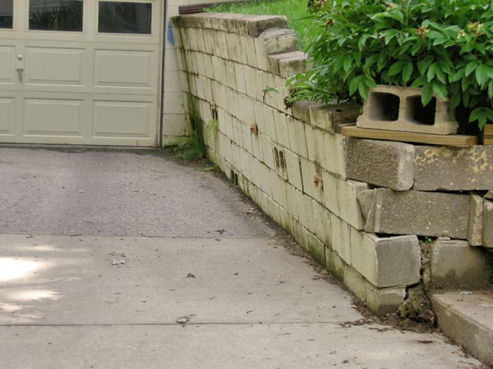 a failing retaining wall around a driveway in Green Bay