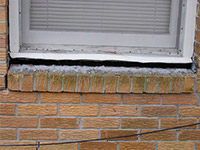A window sill cracking and separating from the foundation wall in a Marinette home.