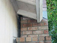 A chimney leaning away from the home on a Two Rivers foundation