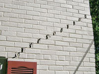 Stair-step cracks showing in a home foundation in Mosinee