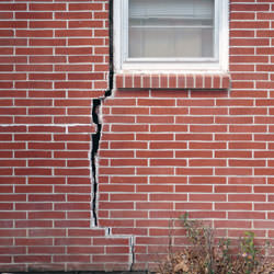 A foundation with a large crack that's wider at the top than on the bottom in Antigo
