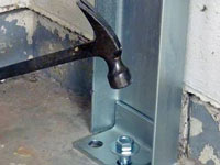 Mounting a foundation channel anchor installation to the floor in Manitowoc.